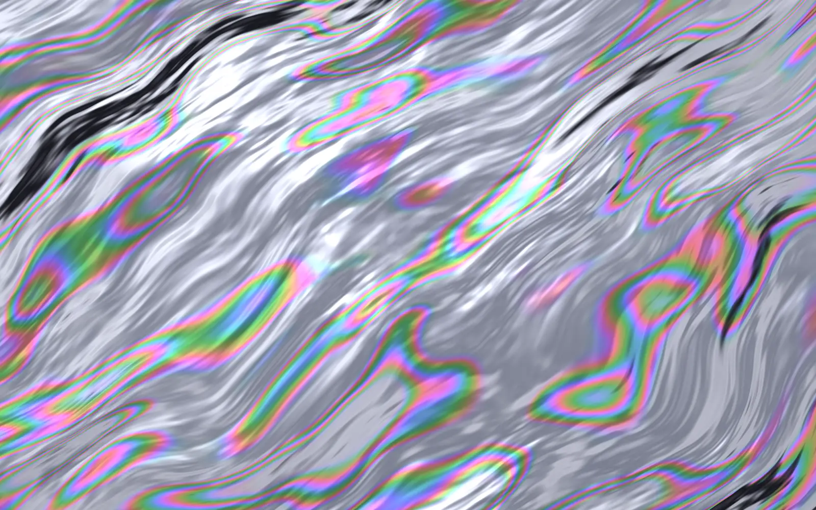 Hologram: silver chrome in long diagonal streaks, with thin rainbow bands running along the sloping flanks
